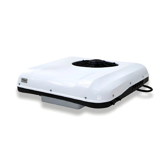Angled exterior view of the Cryonex X700 12V rooftop AC unit showing its white housing and condenser fan.