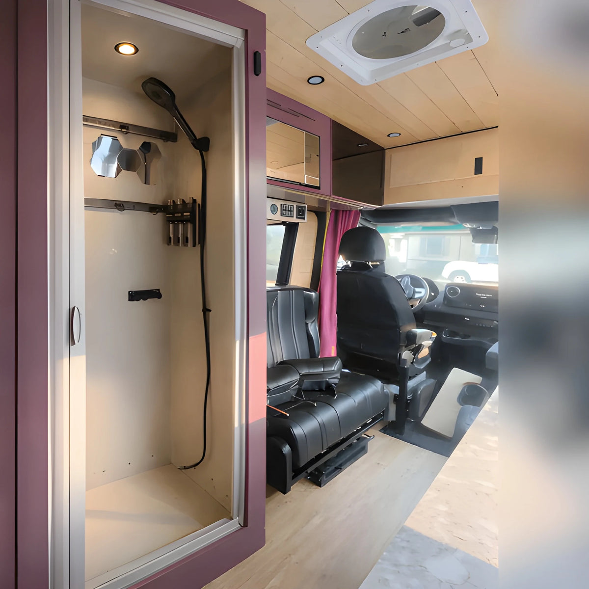 Vankea M aluminum shower installation example inside a Sprinter camper van, with a handheld shower and framed doorway beside the cab.