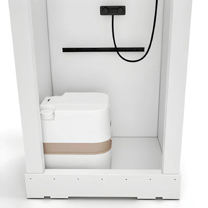Lower interior view of the Vankea XS shower showing a portable toilet, shower hose and white shower pan.