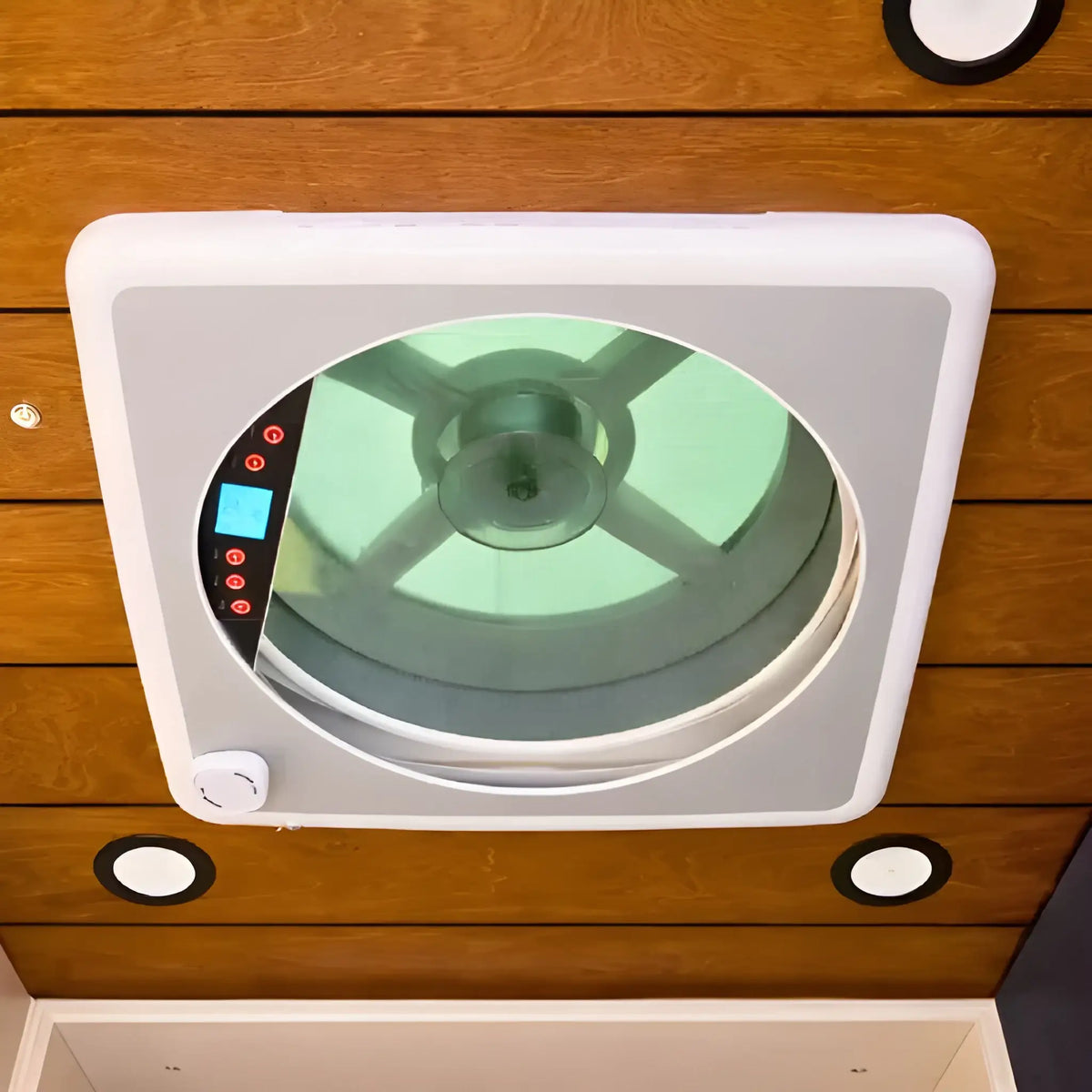 Interior view of the Cryonex camper van roof ventilation fan showing the fan opening, white trim and digital control panel.