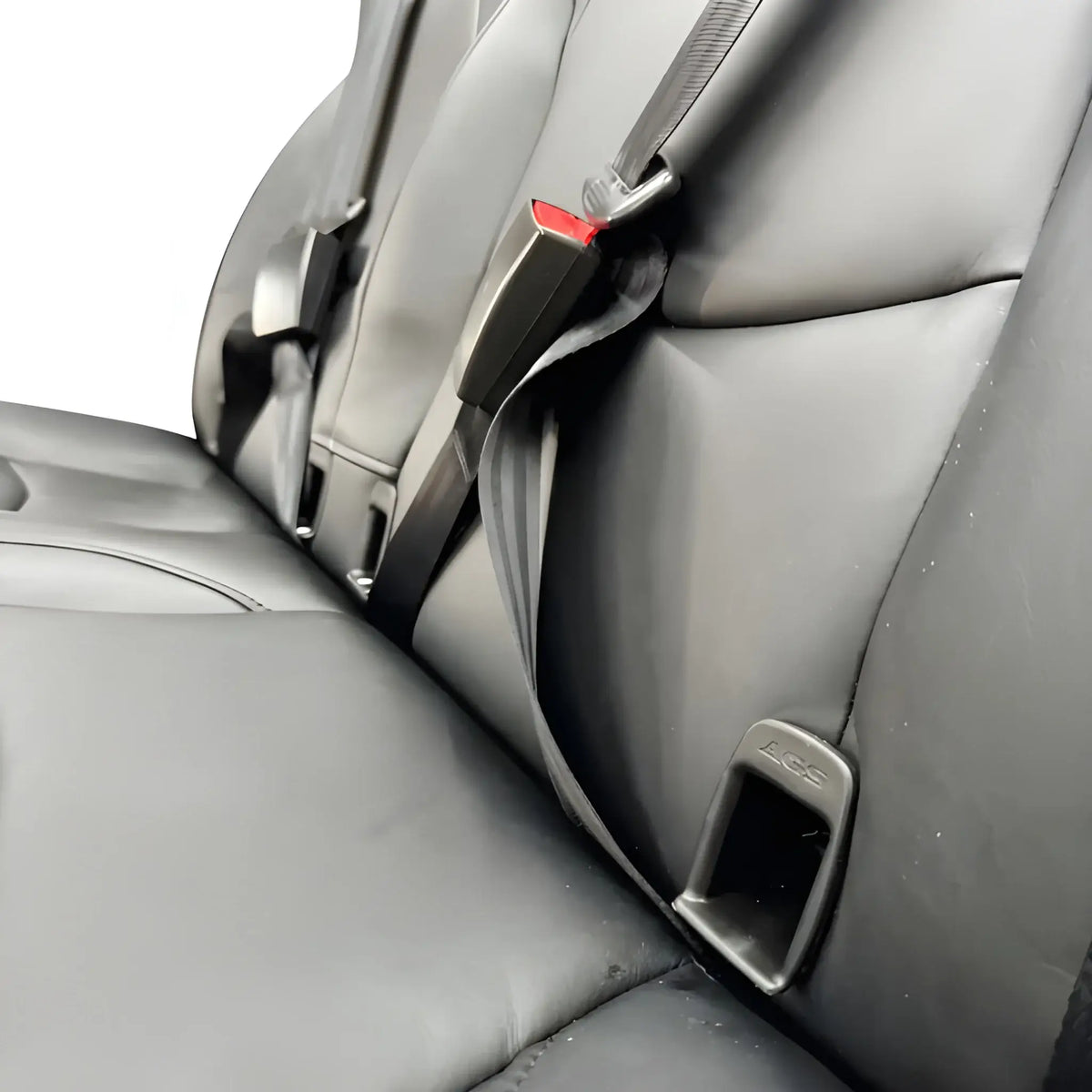 Close-up of the NovaLux Duo RS seat belt buckle, shoulder belt and stitched black upholstery.