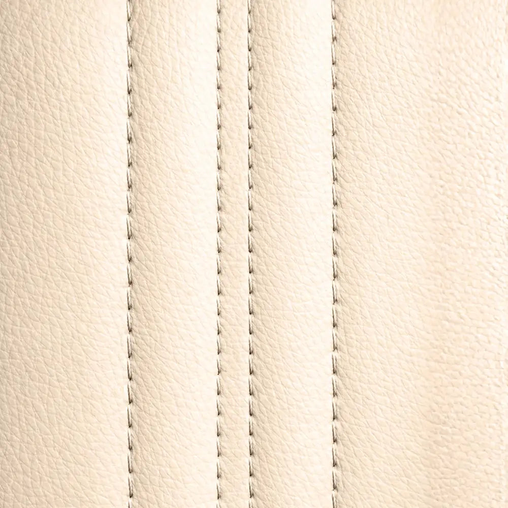 Close-up of the NovaLux Solo GT beige upholstery texture and parallel rows of stitching.