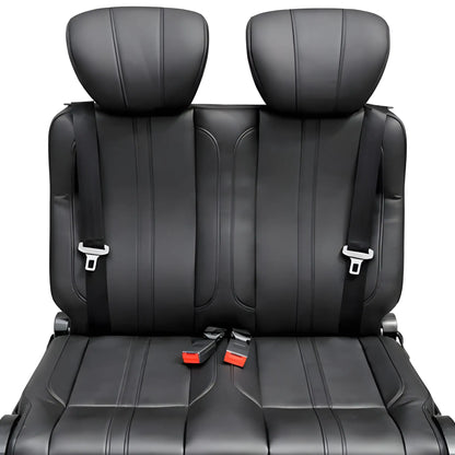 Close-up front view of the NovaLux Classic double van seat showing stitched cushions, headrests and seat belt buckles.